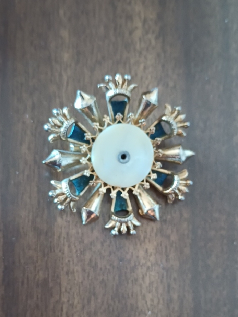 Vintage blue rhinestone and Mother Of Pearl gold-tone starburst brooch